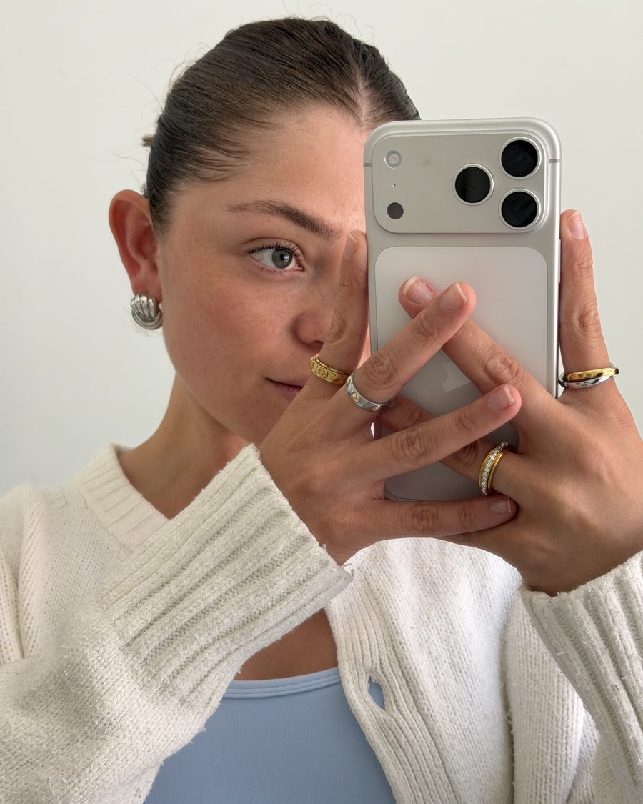 Customer mirror selfie wearing her gold and silver Anxi Rings