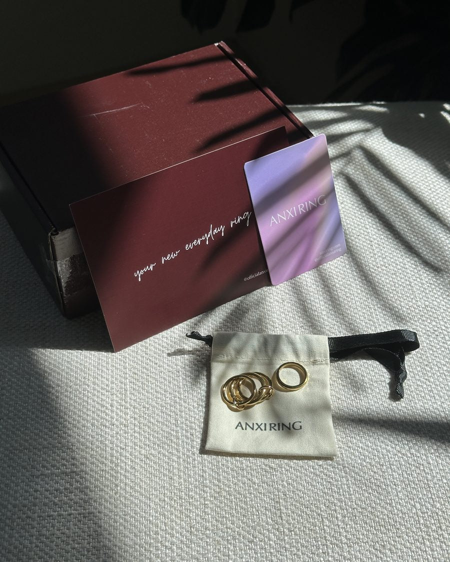 Anxi Ring unboxing with burgundy box, cards and ring pouch