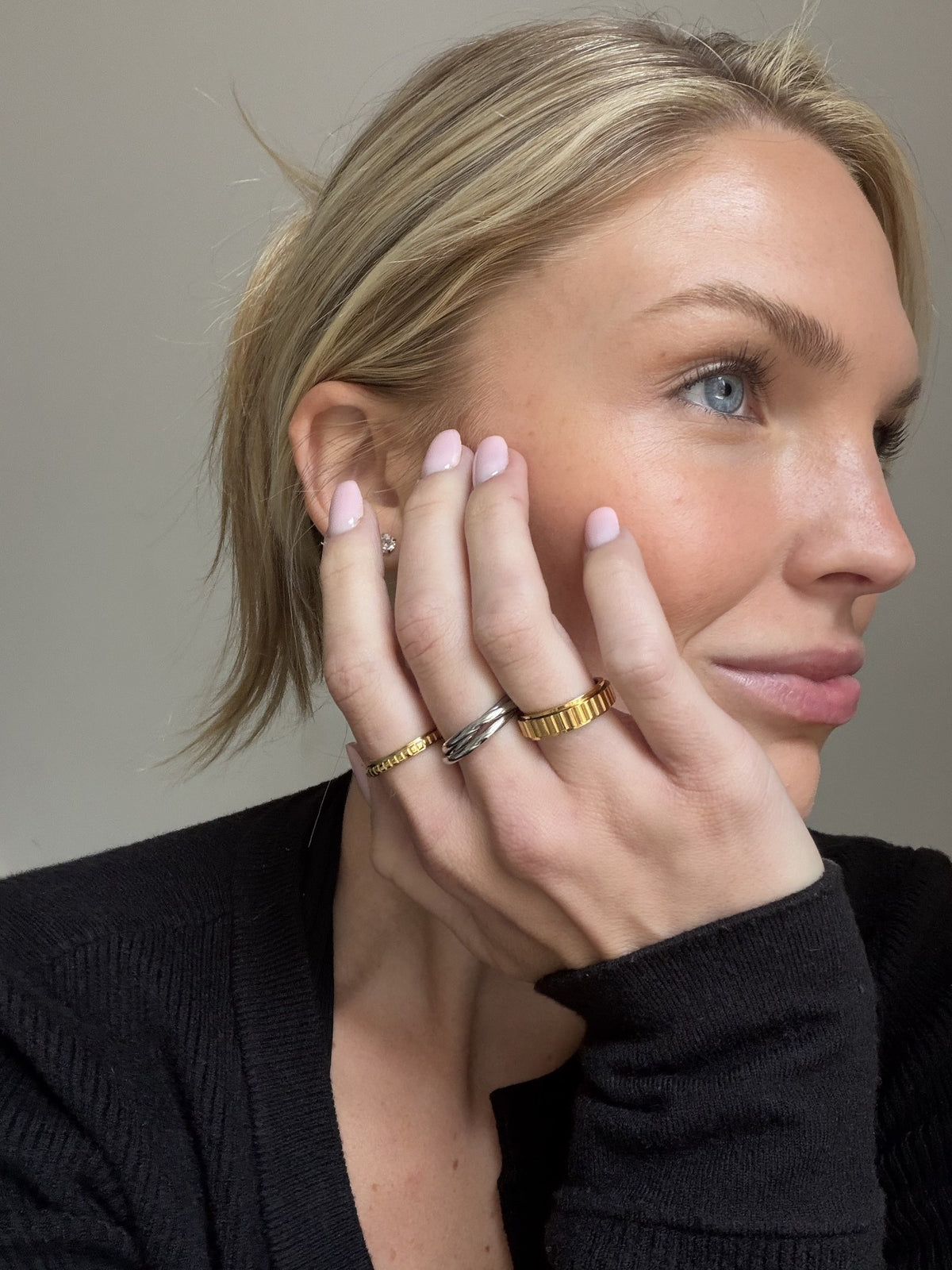 My Way Rotator Anxi Ring worn on the hand, stacked with everyday gold rings