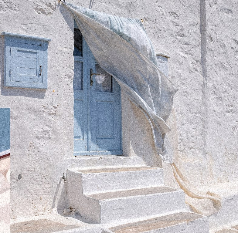 Sunlit doorway by the sea
