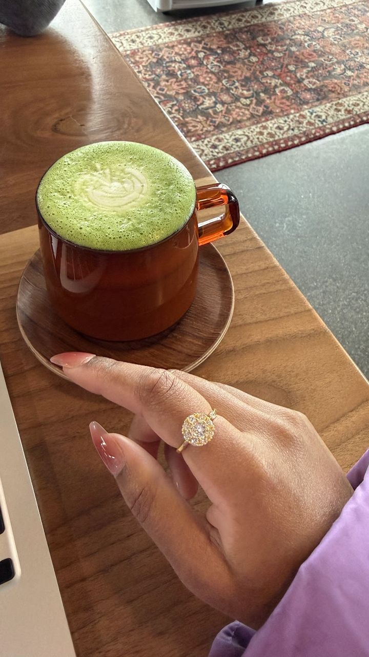 Gold Anxi Ring with an iced matcha by a laptop