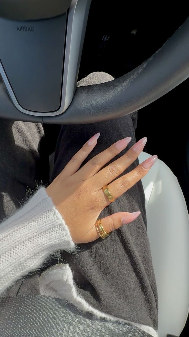 Hand with Anxi Rings on a steering wheel