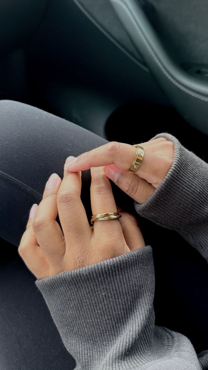 Hands with Anxi Rings in the car