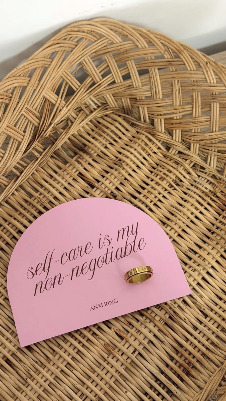 Anxi Ring on the self care card in a wicker basket